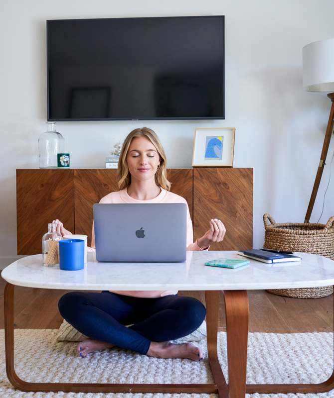 woman meditating virtually