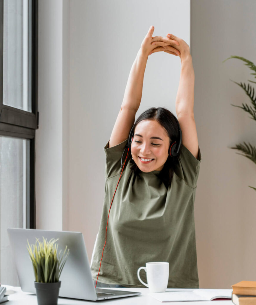 woman stretching at desk