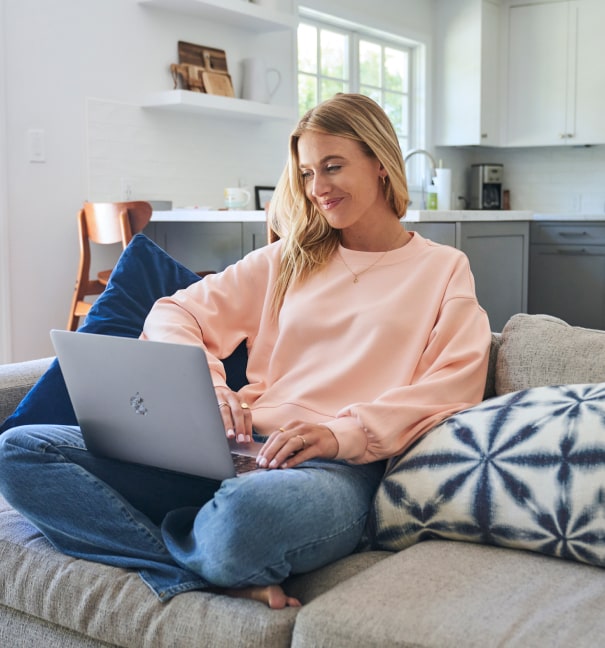 woman smiling on computer