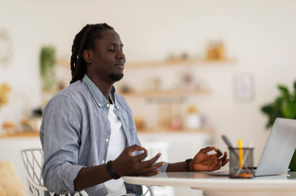 man meditating online