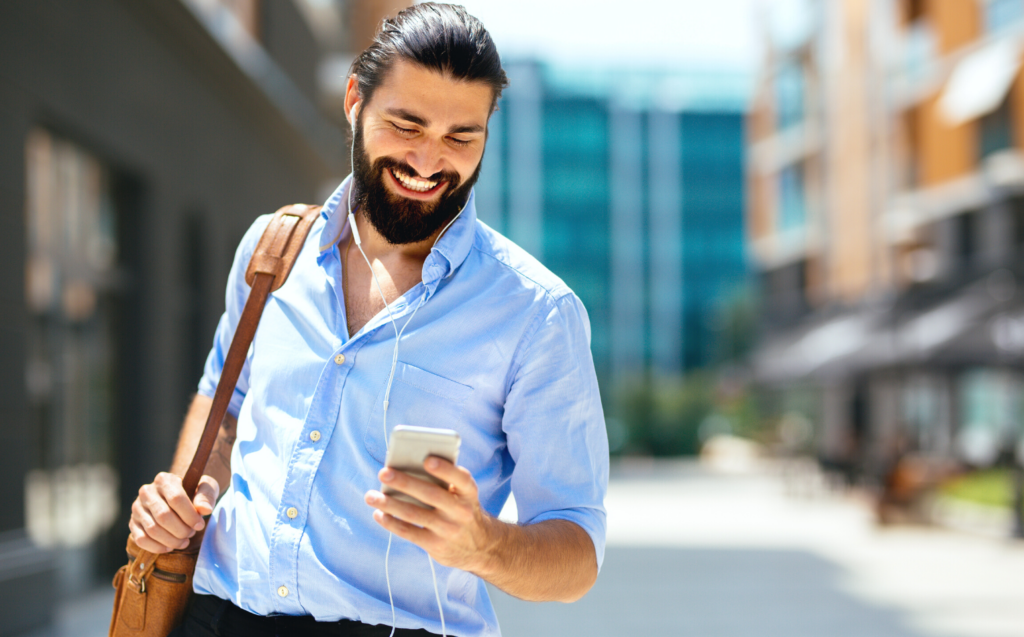 business man smiling at phone