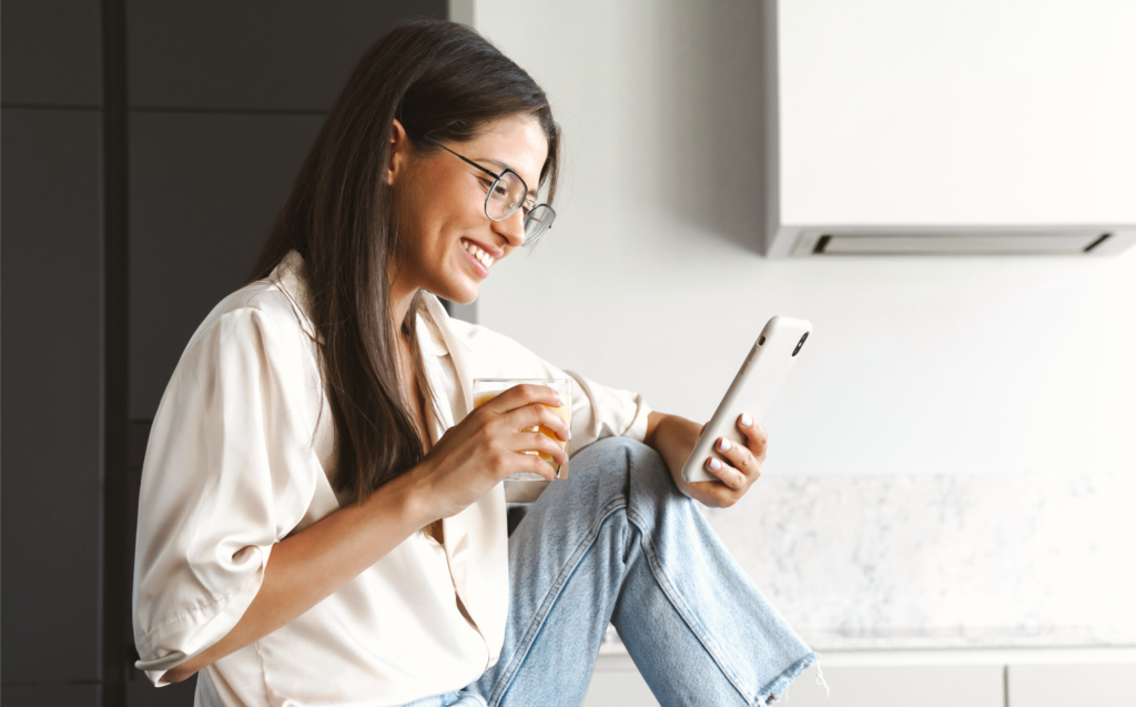 employee smiling at phone screen