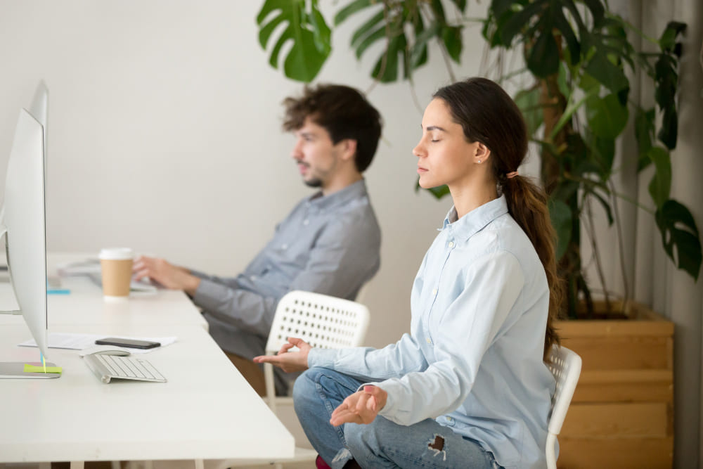 meditating at desk office